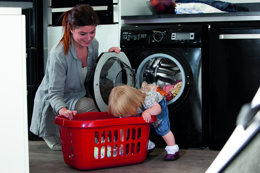 mother and child in a laundry room